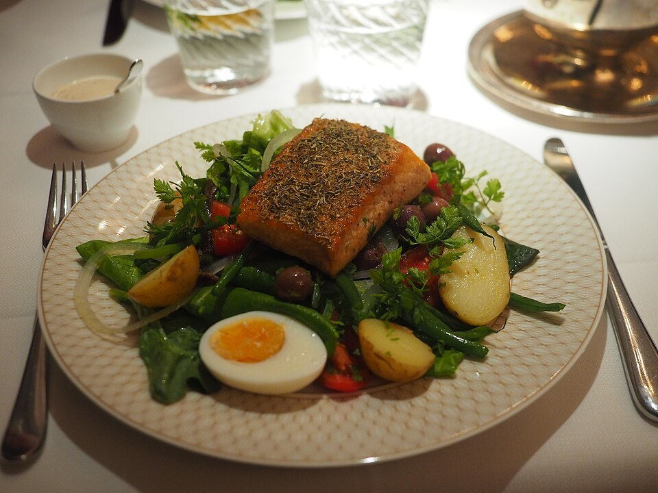 Salmon salad with greens, egg and potatoes