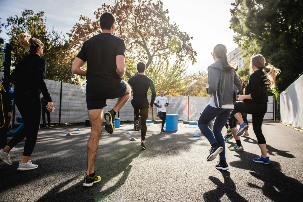 group of friends working out outdoors - featured image